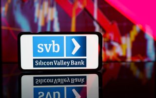 a phone showing an image of the Silicon Valley Bank logo