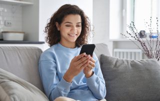 A young woman using her phone.