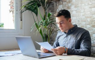 A man looking at some paperwork.