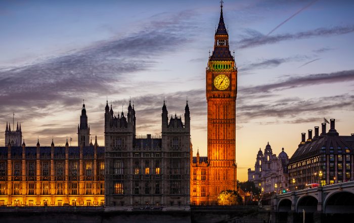 An external image of the Palace of Westminster in the evening