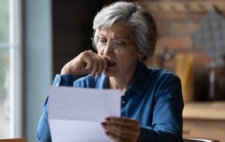 A woman reading a letter.