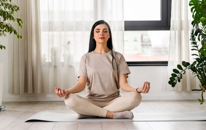 A woman meditating.