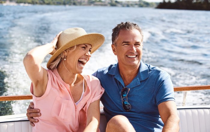 A couple on a yacht cruise.