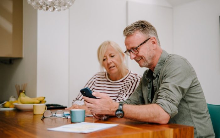 A couple going through paperwork together.
