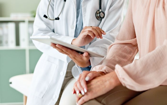 A doctor talking to a patient.