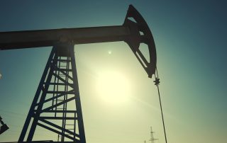 A silhouette of an oil pump.