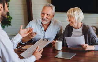 A couple speaking to an adviser.
