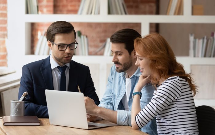 A couple speaking to a mortgage adviser.